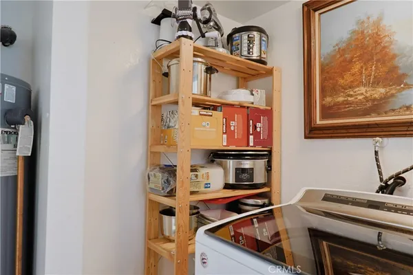 a view of a kitchen with a sink and cabinets