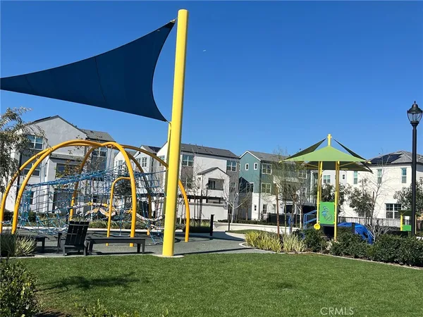 a view of yard with swimming pool and green space