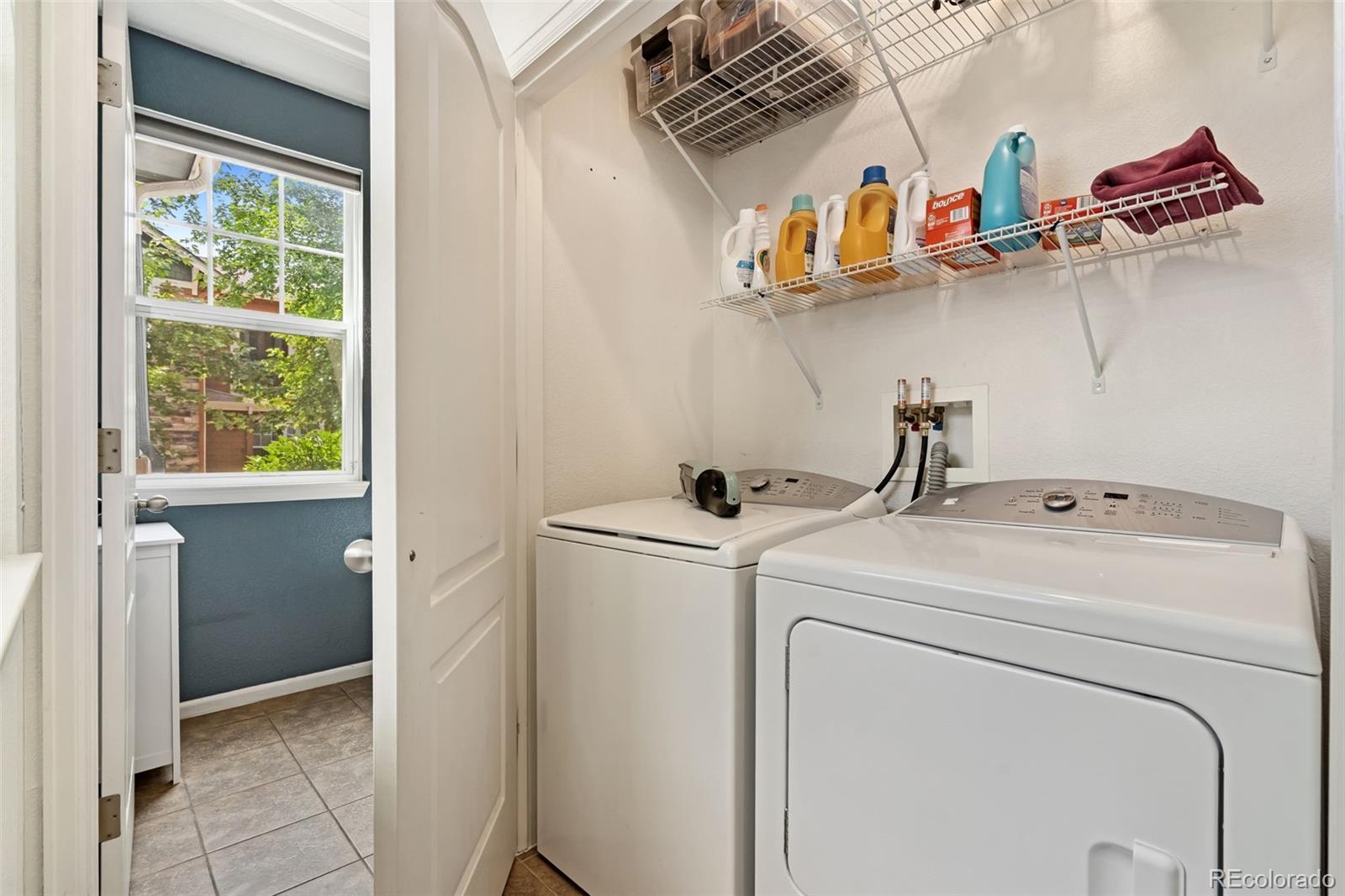 7140 Simms Street, Unit 102 Arvada, CO 80004 - Photo 14 of 34 a utility room with dryer and washer