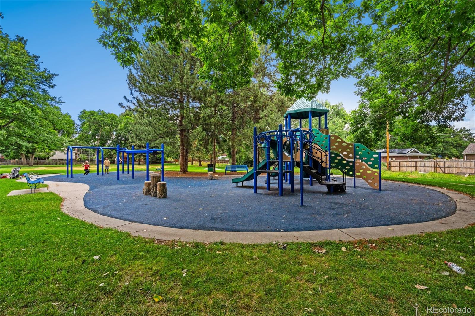 7140 Simms Street, Unit 102 Arvada, CO 80004 - Photo 24 of 34 a view of outdoor space with playground and green space