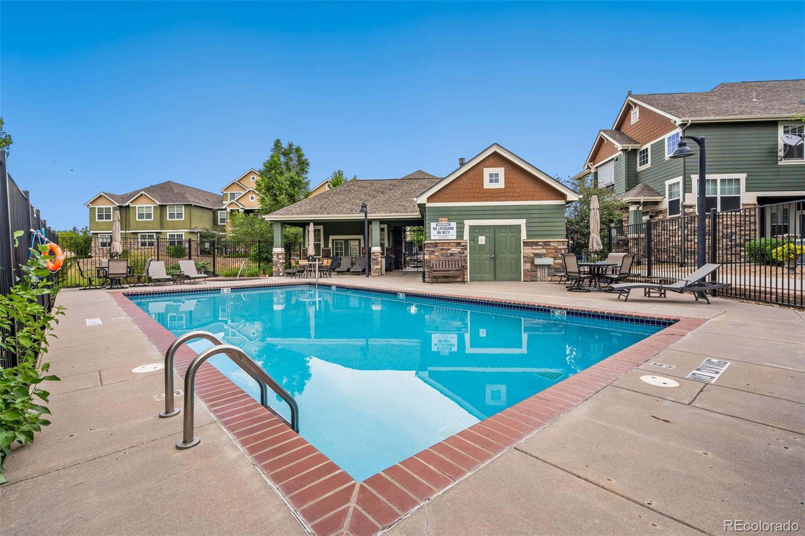 7140 Simms Street, Unit 102 Arvada, CO 80004 - Photo 30 of 34 a view of a house with a swimming pool