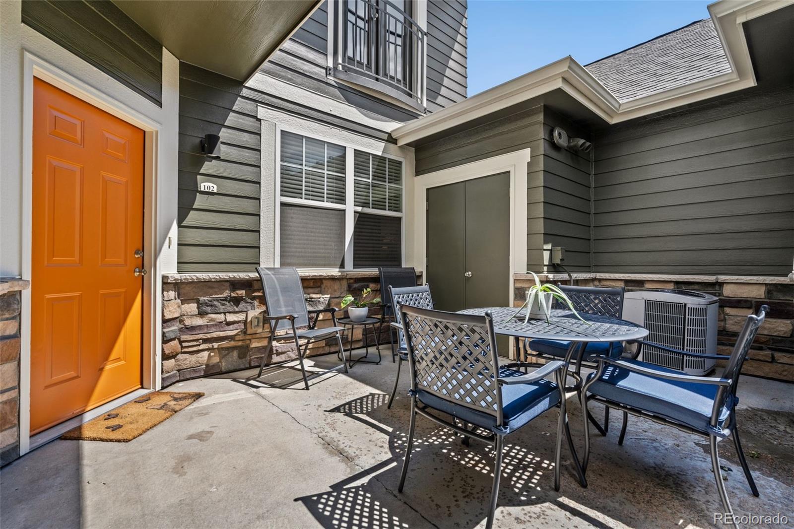 7140 Simms Street, Unit 102 Arvada, CO 80004 - Photo 33 of 34 a view of backyard with outdoor seating
