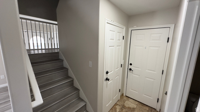 3547 East Golden Eagle Road Eagle Mountain, UT 84005 - Photo 12 of 47 Staircase featuring stone finish floors