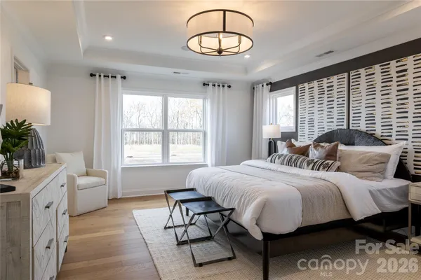 a bedroom with bed and a window