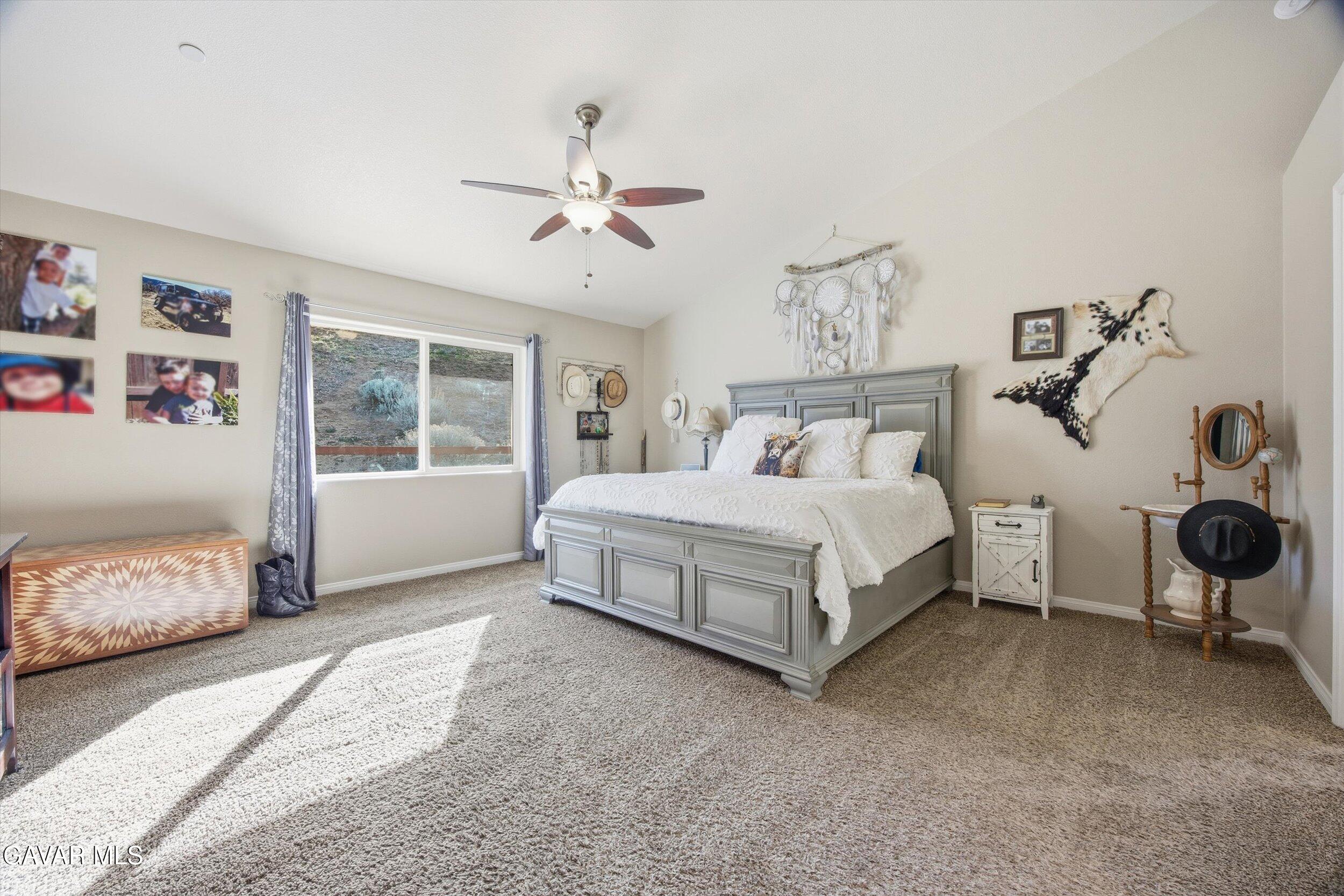 17820 Bold Venture Drive Tehachapi, CA 93561 - Photo 31 of 50 a spacious bedroom with a bed and window