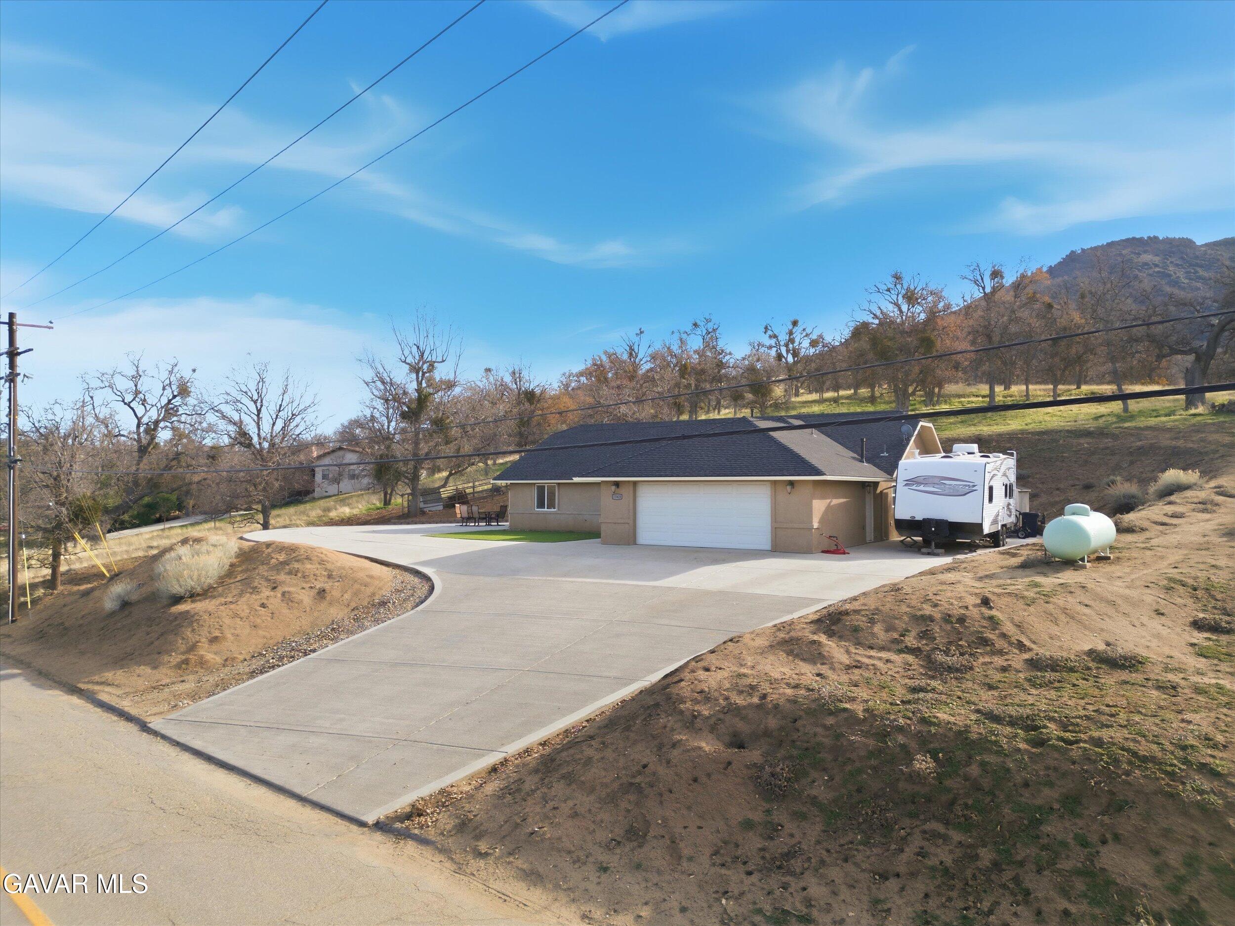 17820 Bold Venture Drive Tehachapi, CA 93561 - Photo 7 of 50 a view of a house with a yard
