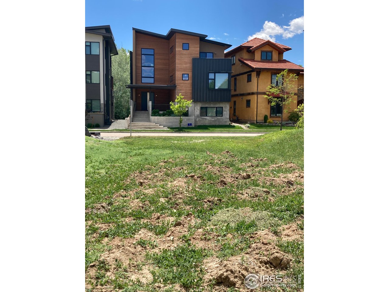232 Pascal Street Fort Collins, CO 80524 - Photo 3 of 13 a house view with swimming pool in front of it