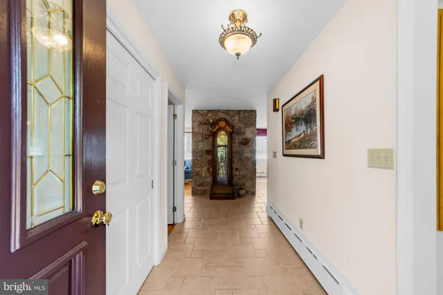 a work room with wooden floor and furniture