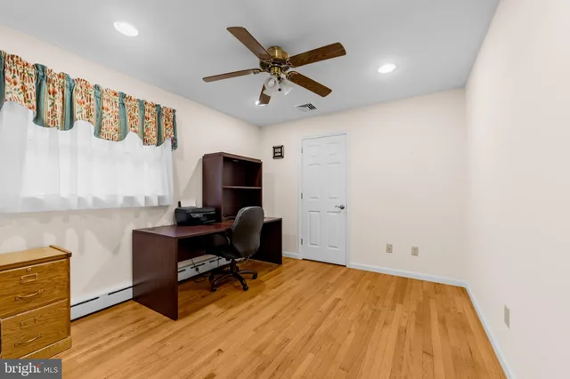 a living room with fireplace furniture and a fireplace