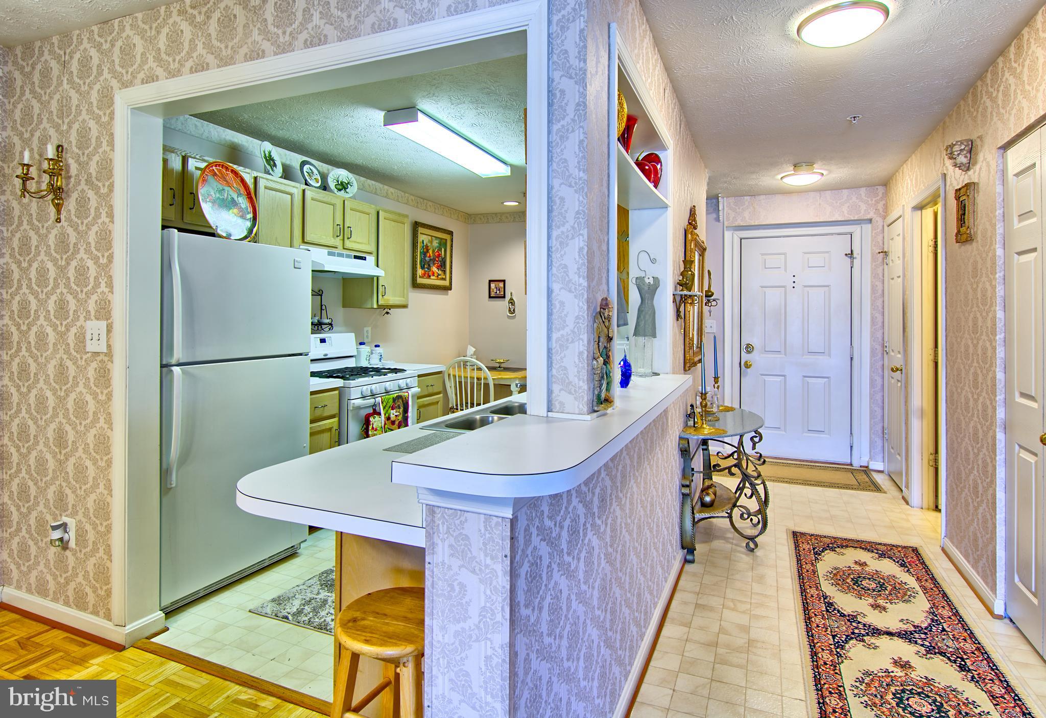 826 Kennington Road Reisterstown, MD 21136 - Photo 11 of 29 Long Foyer Open to Kitchen and Dining