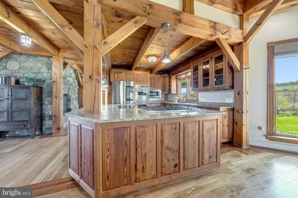 a large room with wooden floors and glass doors