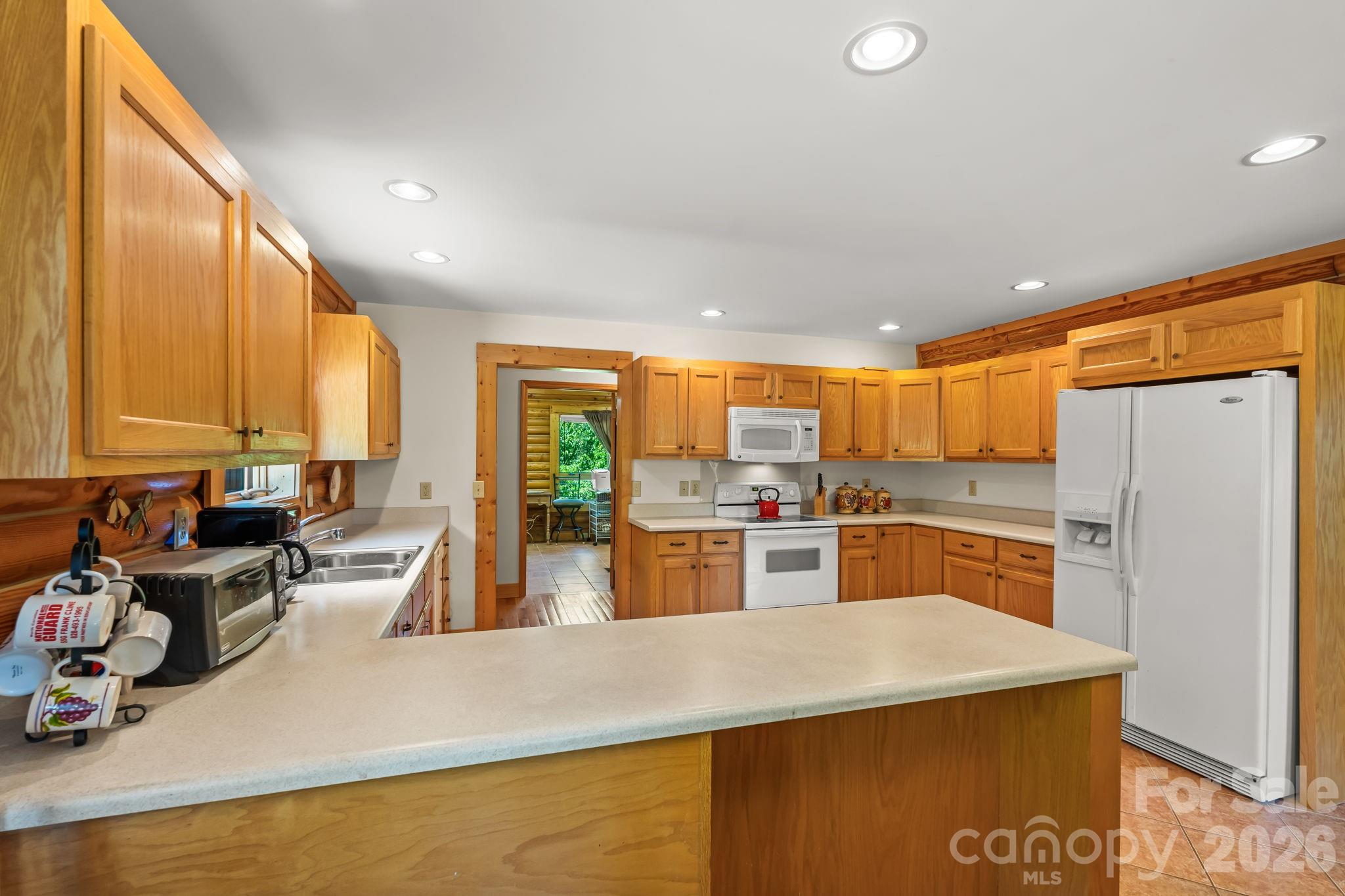 3341 Peniel Road Tryon, NC 28782 - Photo 14 of 48 a kitchen with a large window appliances and cabinets