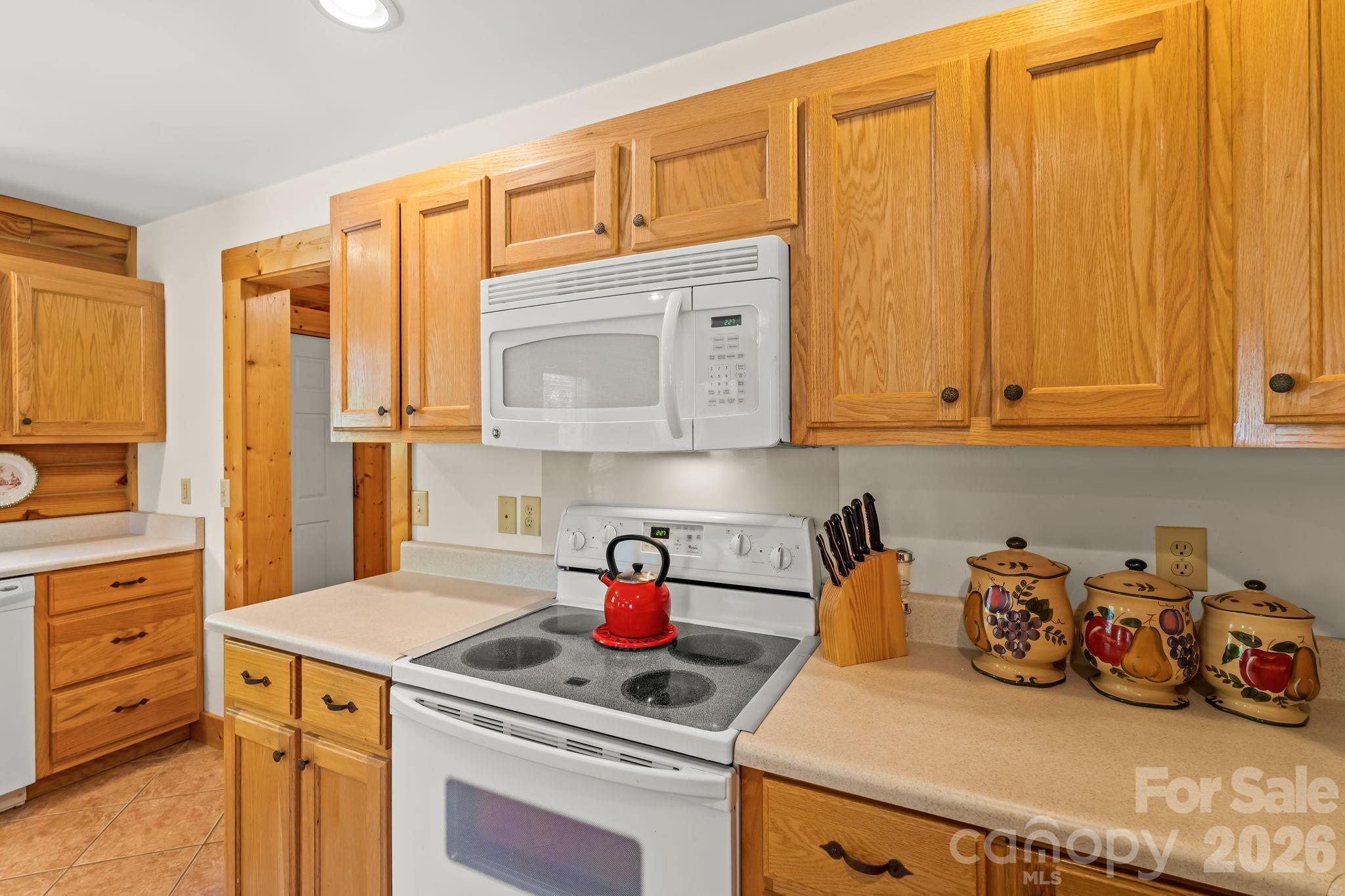 3341 Peniel Road Tryon, NC 28782 - Photo 16 of 48 a kitchen with stainless steel appliances granite countertop a sink stove and cabinets