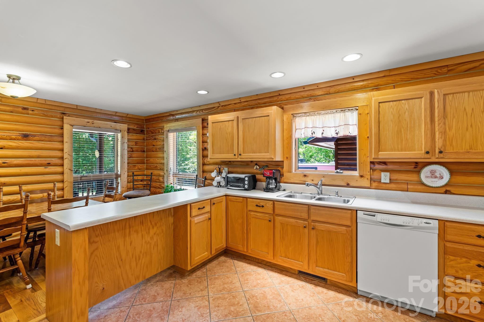 3341 Peniel Road Tryon, NC 28782 - Photo 17 of 48 a large kitchen with a sink and cabinets