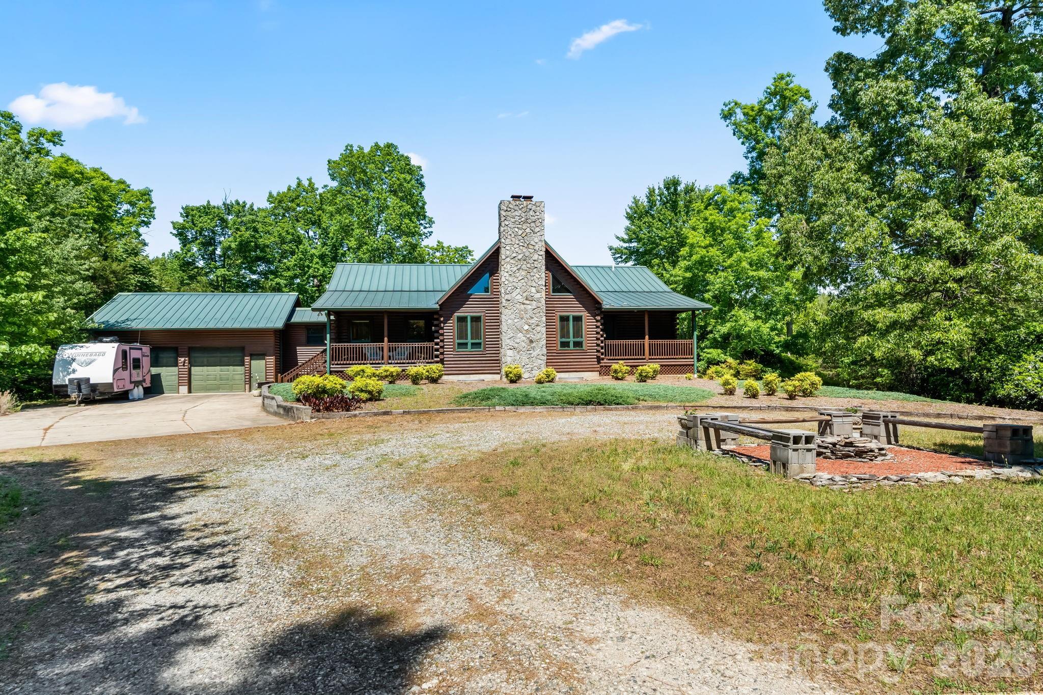 3341 Peniel Road Tryon, NC 28782 - Photo 2 of 48 a view of a house with backyard and sitting area