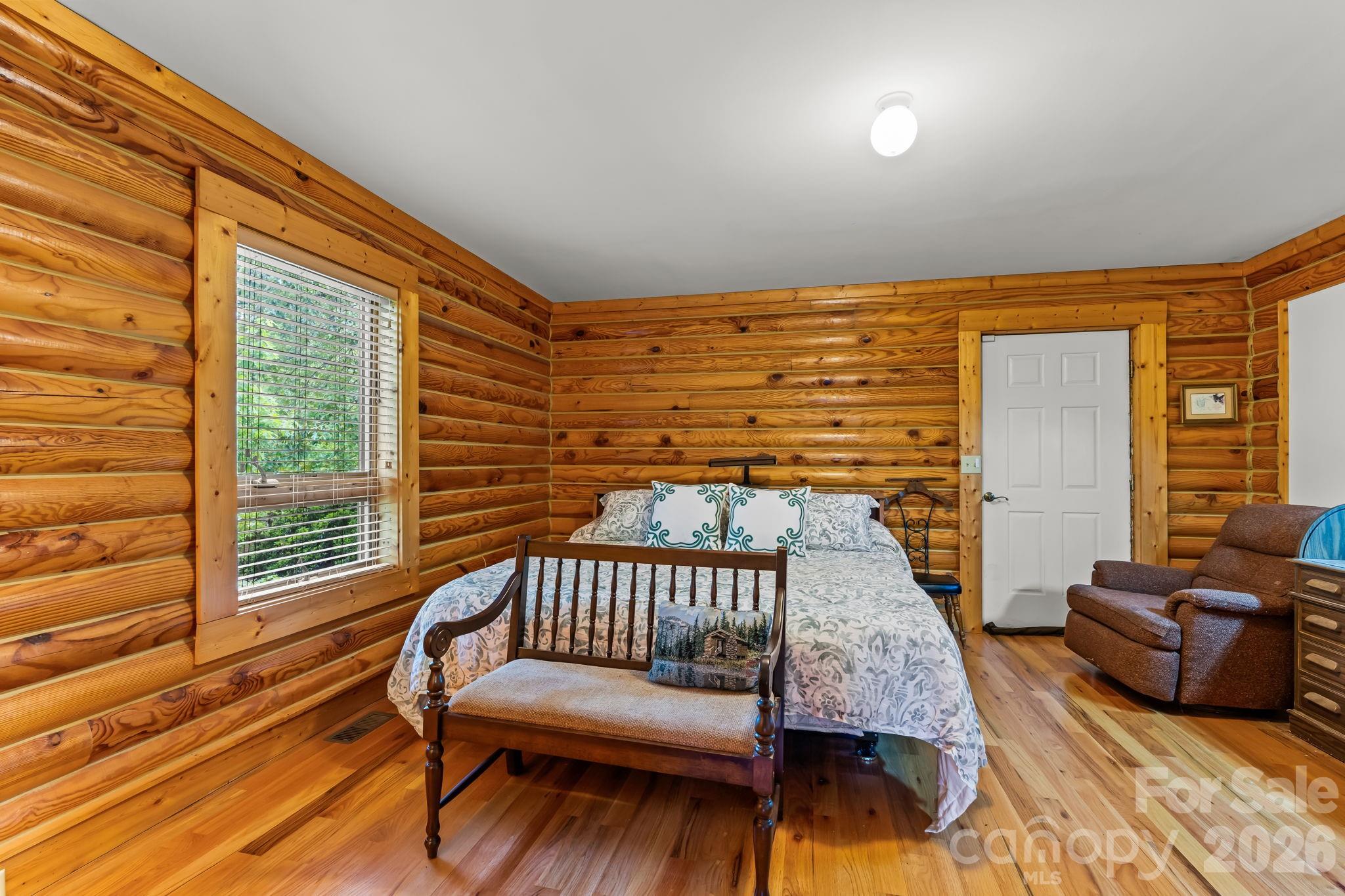 3341 Peniel Road Tryon, NC 28782 - Photo 21 of 48 a balcony with furniture and wooden floor
