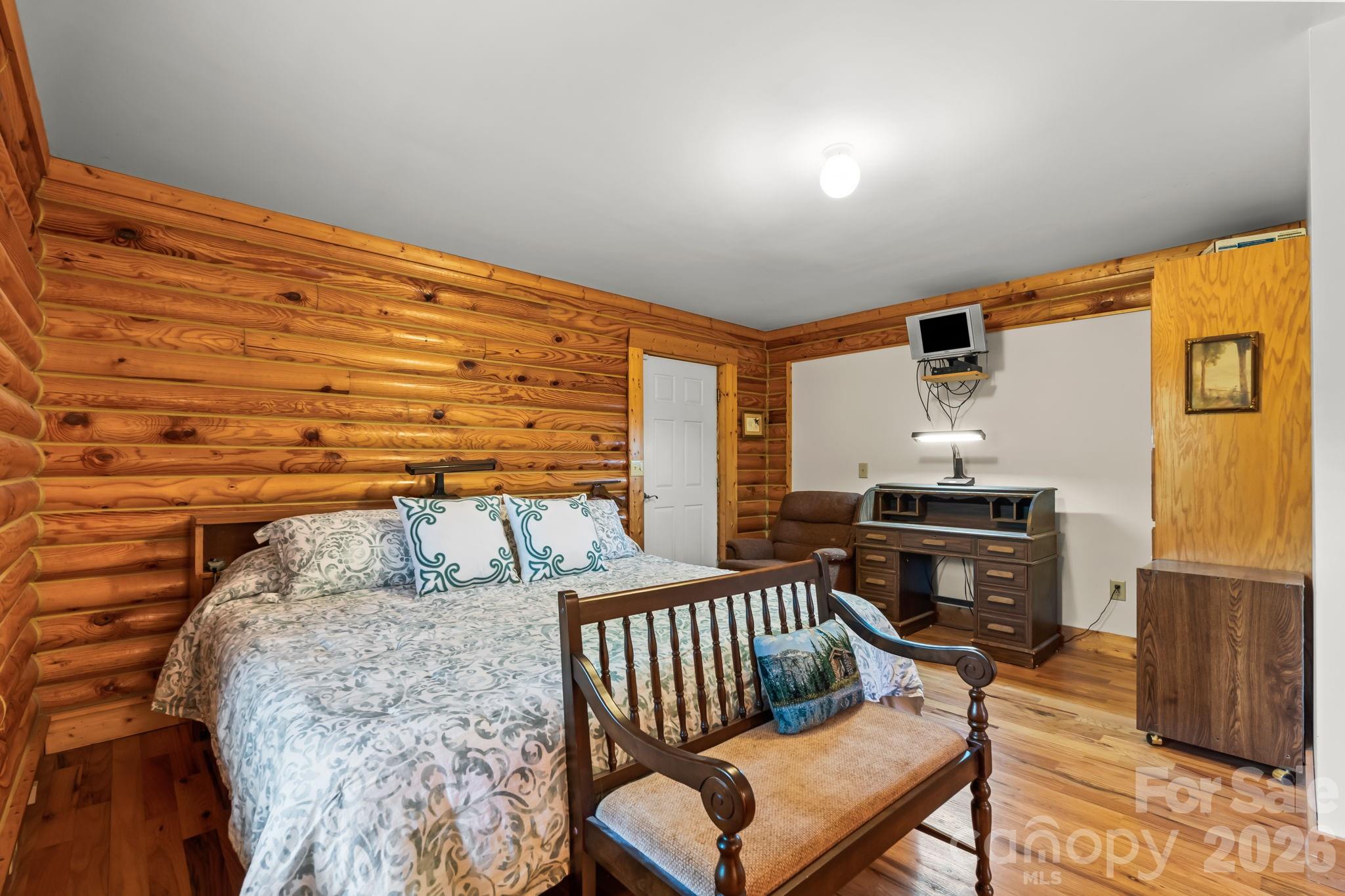 3341 Peniel Road Tryon, NC 28782 - Photo 22 of 48 a bedroom with furniture and a window