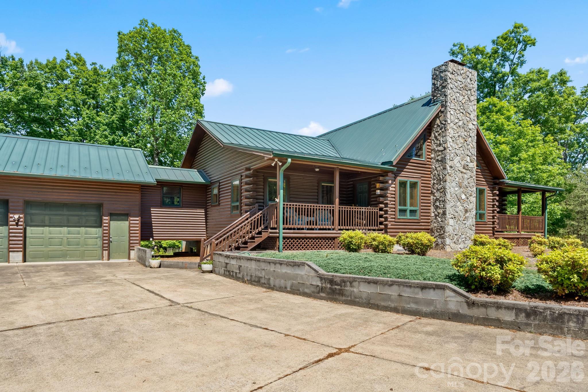 3341 Peniel Road Tryon, NC 28782 - Photo 3 of 48 a view of house with backyard and a garden