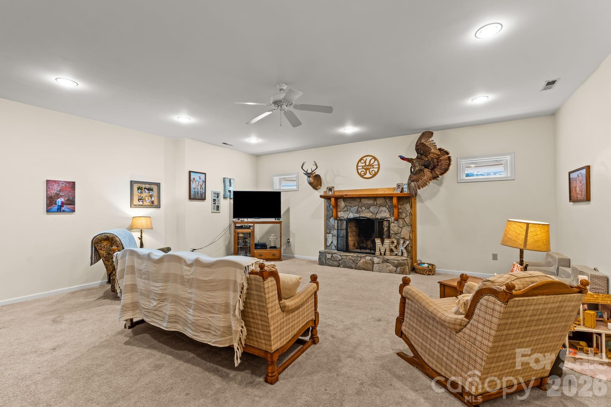 3341 Peniel Road Tryon, NC 28782 - Photo 32 of 48 a living room with furniture and a fireplace