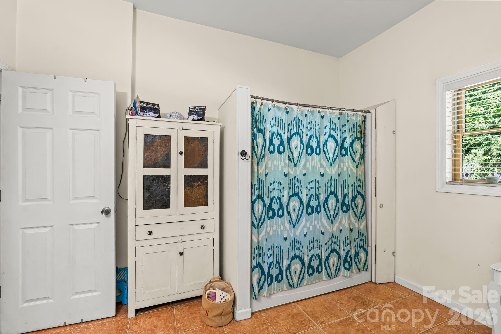 3341 Peniel Road Tryon, NC 28782 - Photo 42 of 48 a view of a bedroom with wooden floor and closet