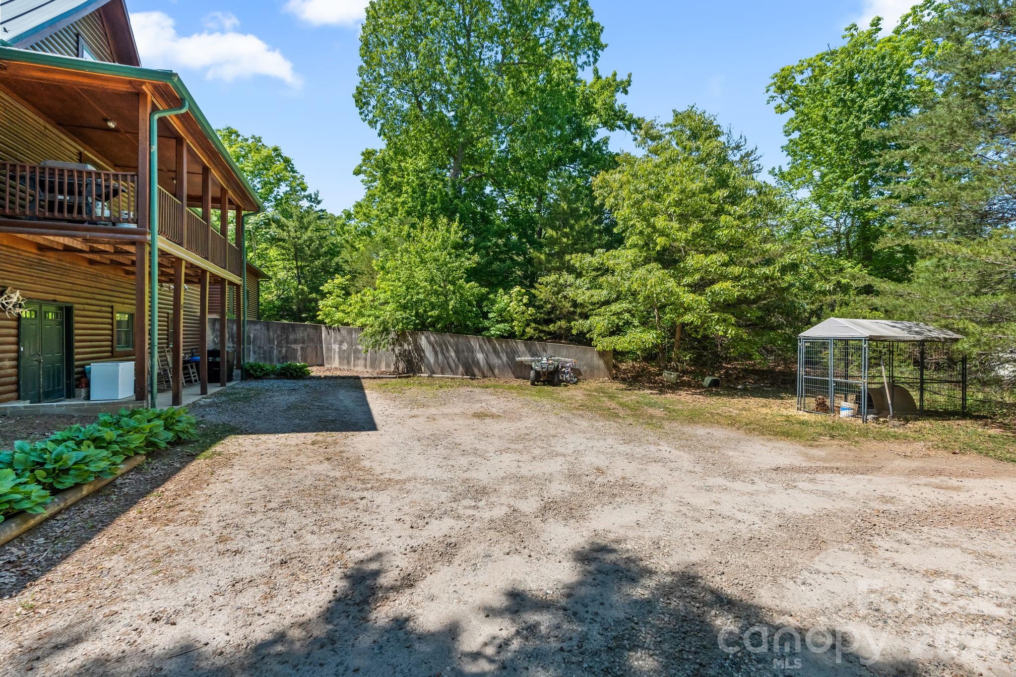 3341 Peniel Road Tryon, NC 28782 - Photo 45 of 48 a view of a yard with plants and trees