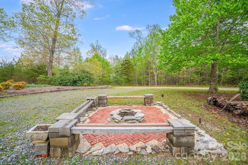 3341 Peniel Road Tryon, NC 28782 - Photo 47 of 48 a view of a lake with a yard and a patio