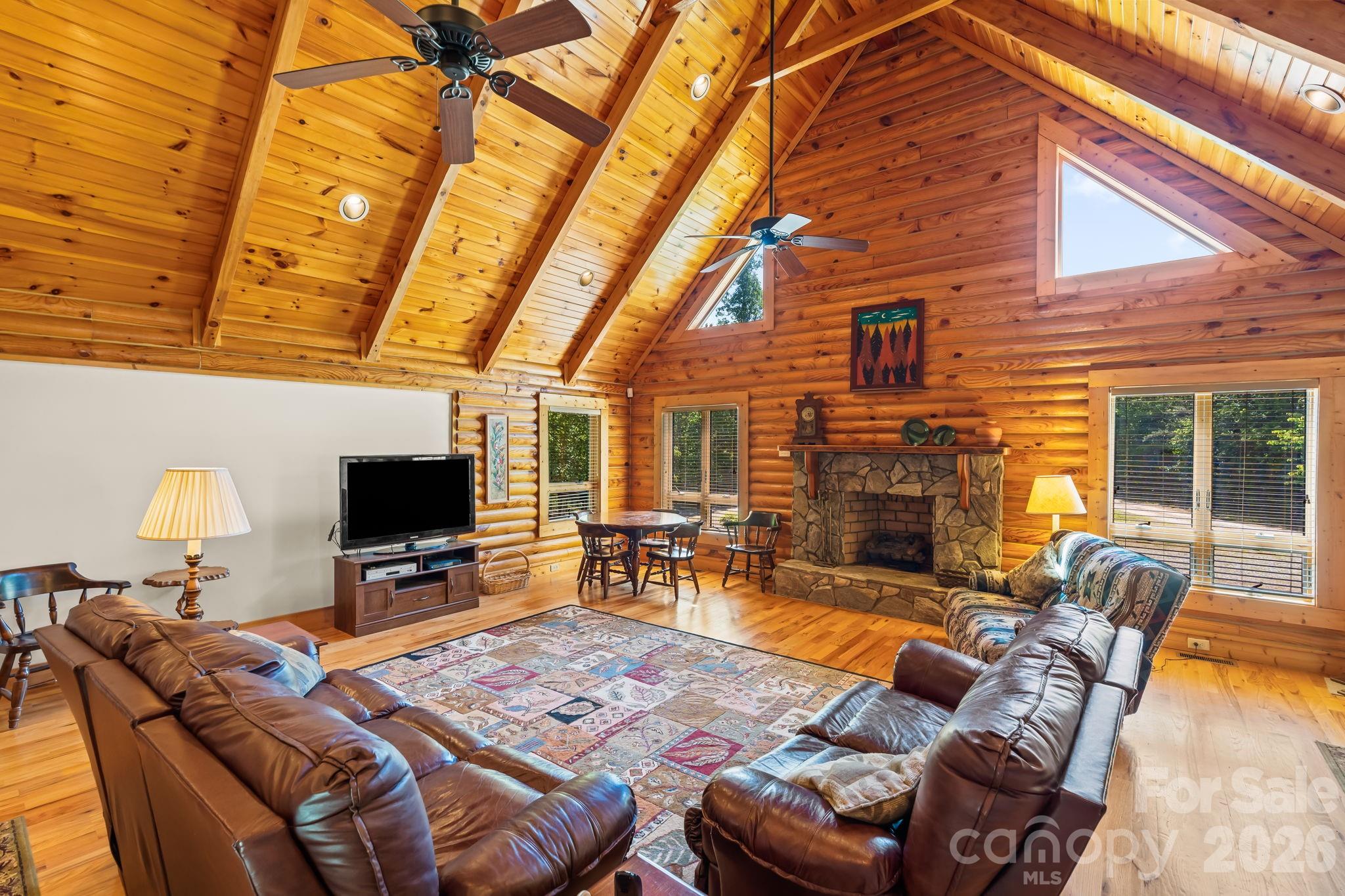 3341 Peniel Road Tryon, NC 28782 - Photo 9 of 48 a living room with furniture a fireplace and a flat screen tv