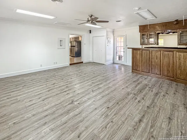 a front view of a house with a wooden fence