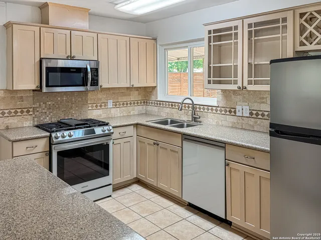 a living room with a flat screen tv and outdoor view