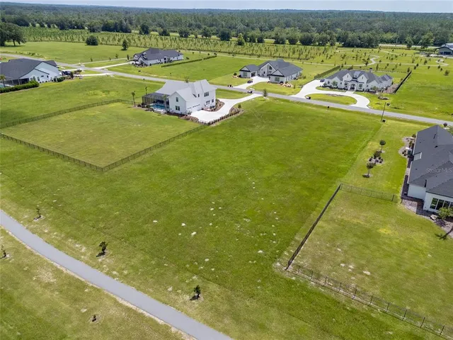 a view of a lake with a yard
