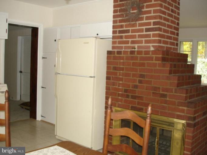5501 Blacksburg Road Springfield, VA 22151 - Photo 14 of 29 Double sided fireplace in DR area and LR.