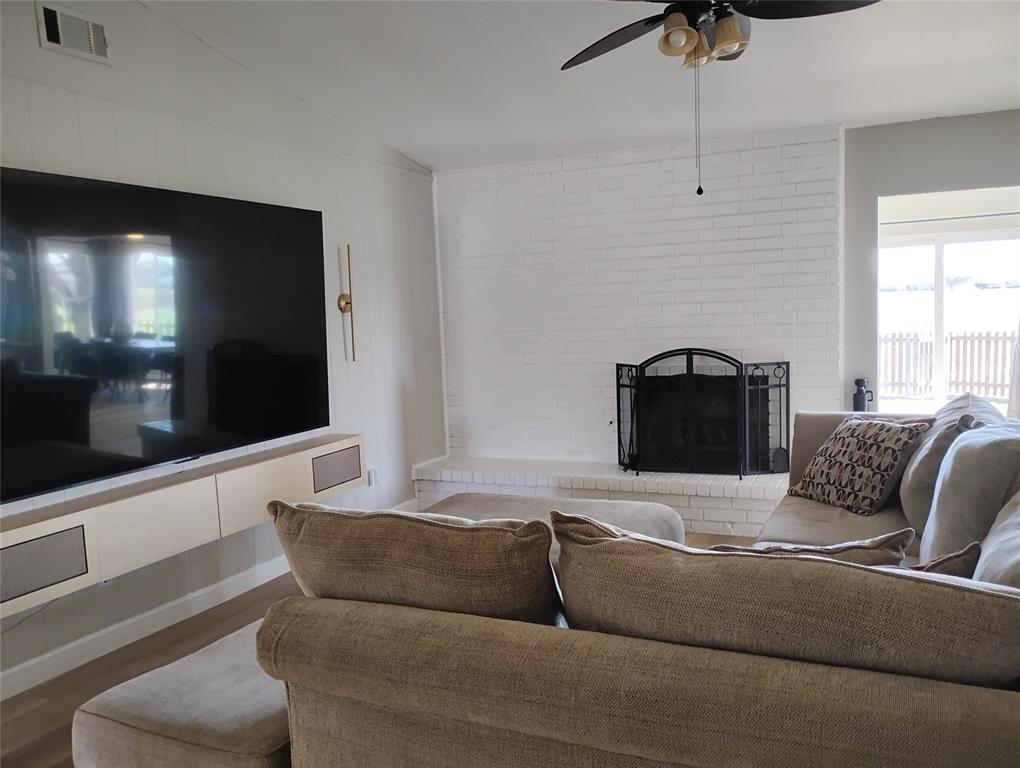 1954 Rambling Ridge Lane Carrollton, TX 75007 - Photo 11 of 23 Main living room with wood burning fireplace.