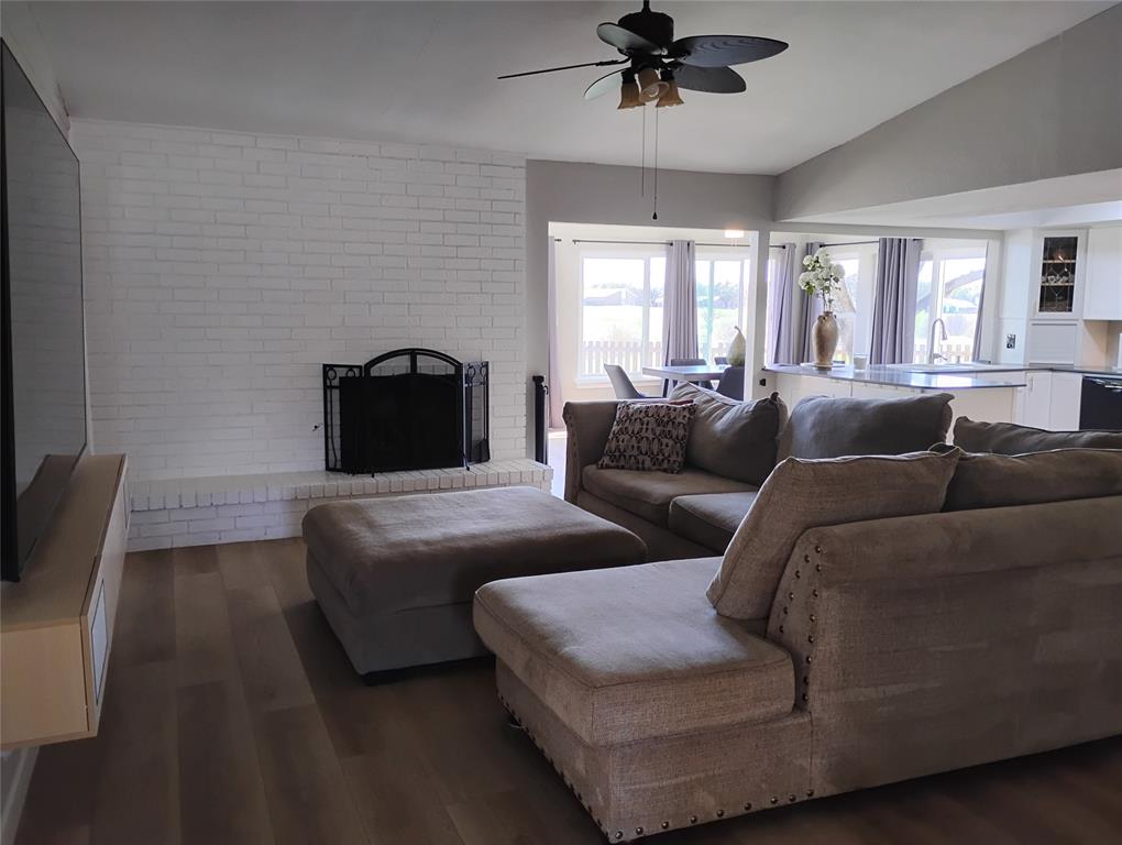 1954 Rambling Ridge Lane Carrollton, TX 75007 - Photo 12 of 23 Main living room with open concept for ease of conversation between rooms. Updated flooring.