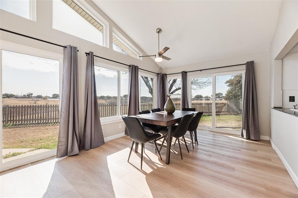 1954 Rambling Ridge Lane Carrollton, TX 75007 - Photo 4 of 23 a view of a dining room with furniture window and wooden floor