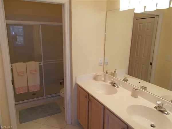 a bathroom with a sink and mirror