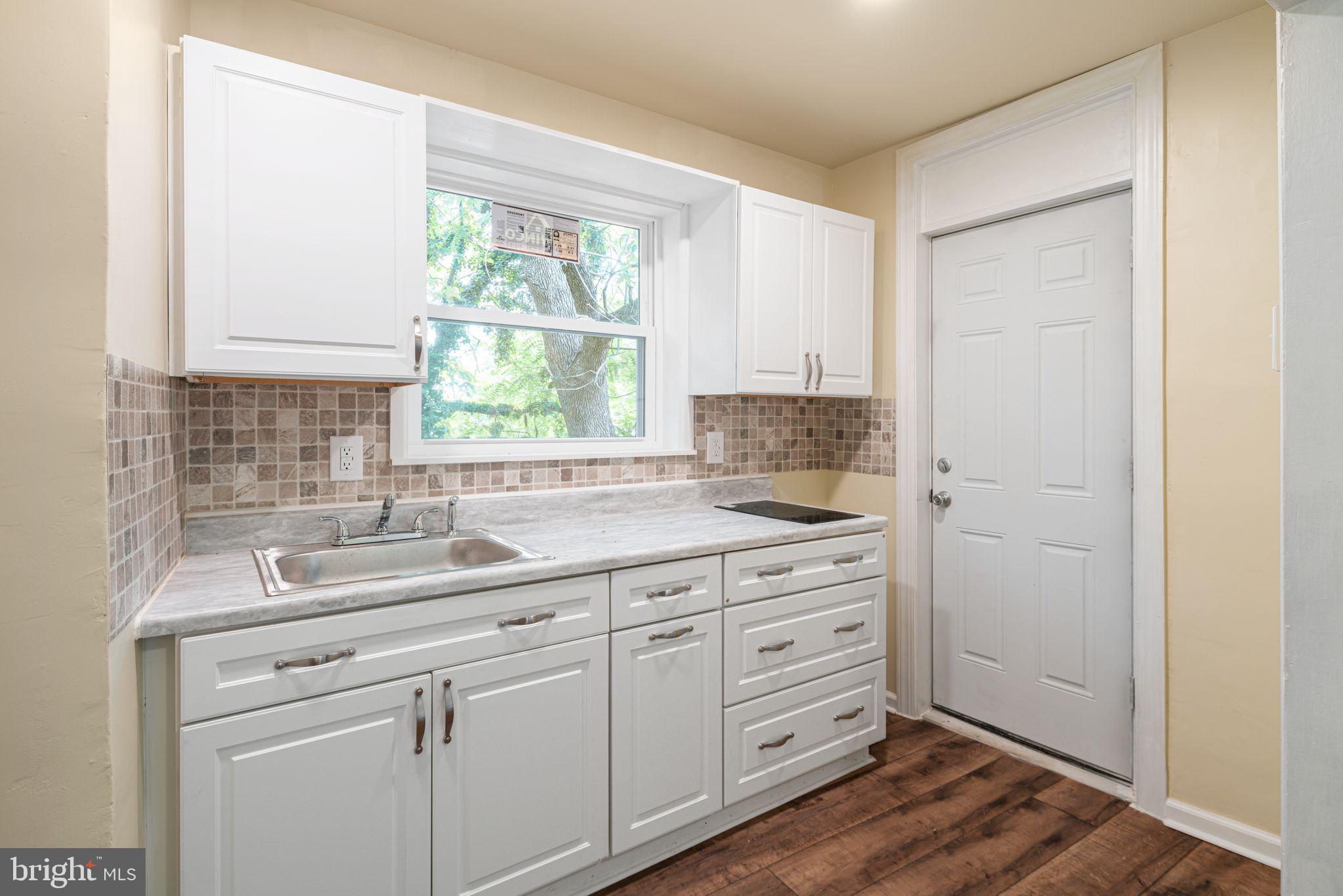7153 Germantown Avenue, Unit 4 Philadelphia, PA 19119 - Photo 3 of 11 a kitchen with a sink and cabinets