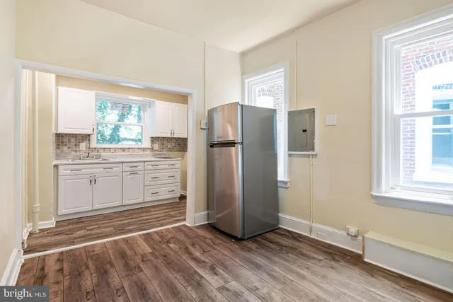 a kitchen with stainless steel appliances a refrigerator and a sink