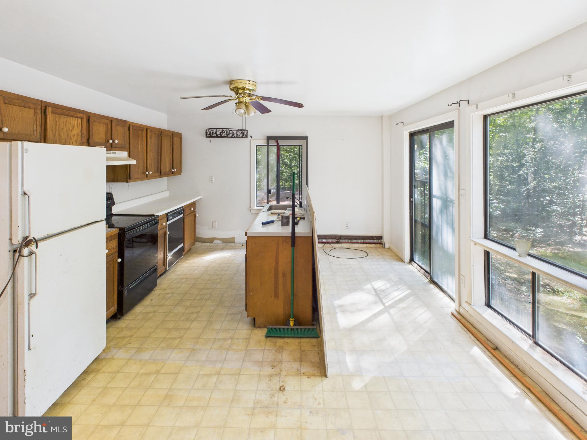 11330 Holly Springs Road Nanjemoy, MD 20662 - Photo 13 of 42 a view of a kitchen with a sink and refrigerator