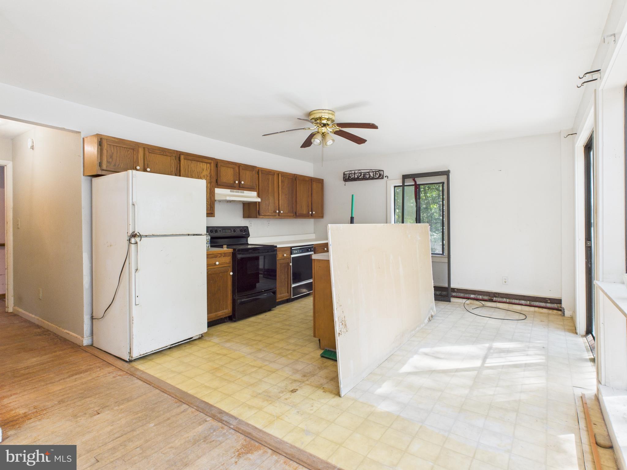 11330 Holly Springs Road Nanjemoy, MD 20662 - Photo 14 of 42 a view of kitchen with refrigerator and microwave