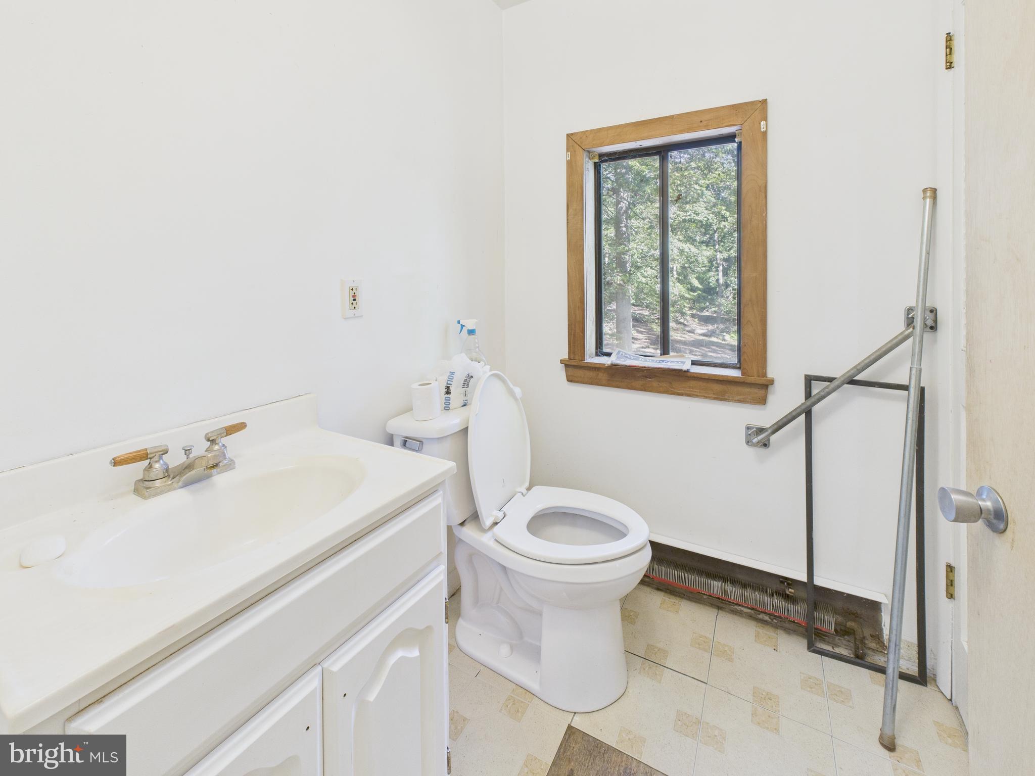 11330 Holly Springs Road Nanjemoy, MD 20662 - Photo 21 of 42 a bathroom with a sink toilet and shower