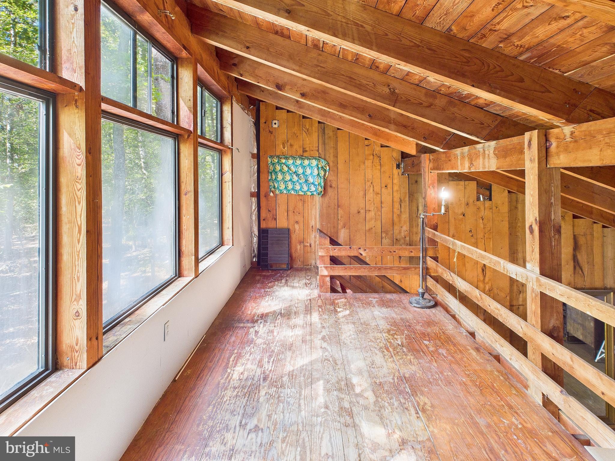 11330 Holly Springs Road Nanjemoy, MD 20662 - Photo 25 of 42 a view of an empty room with wooden floor and furniture