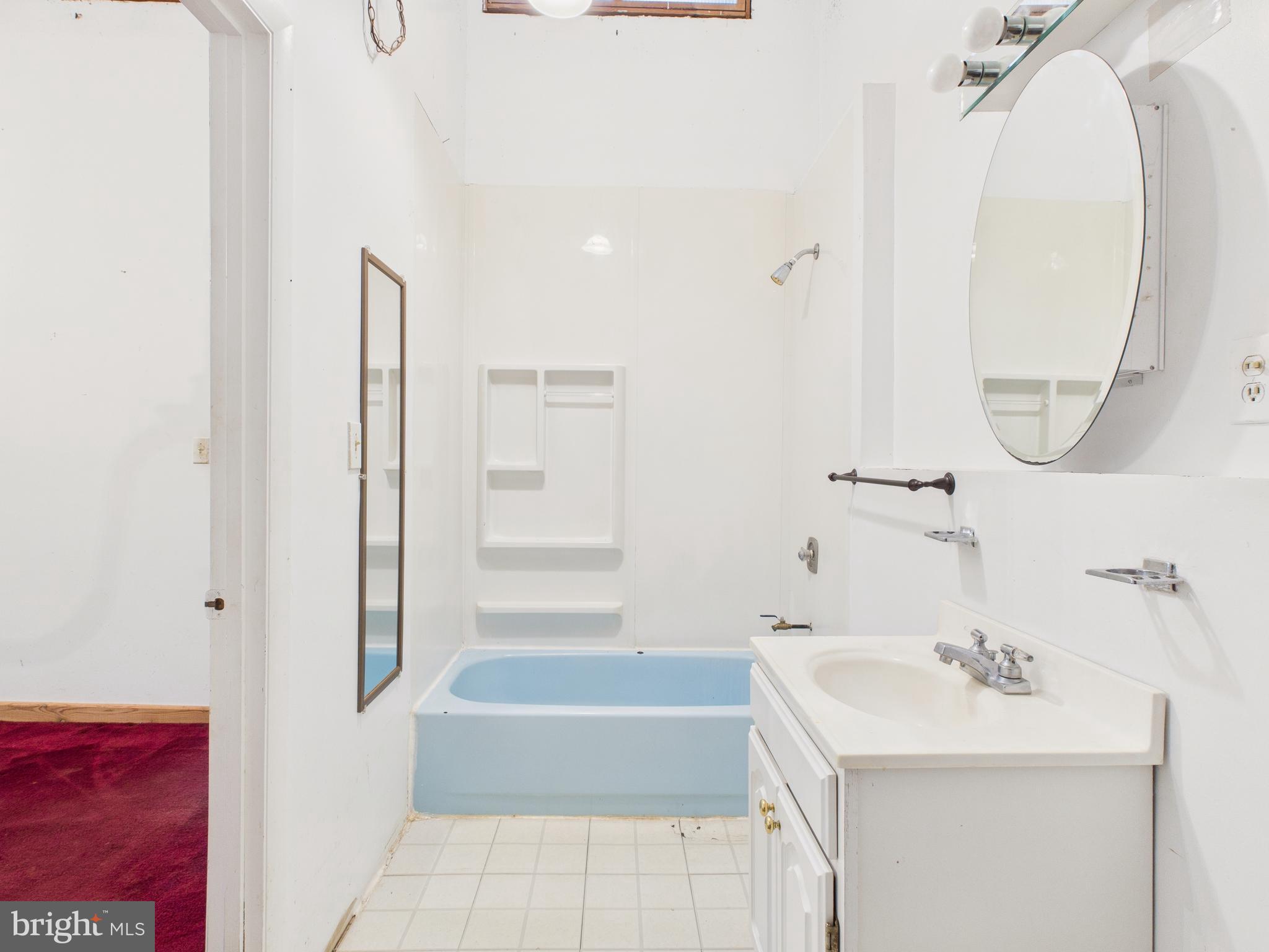 11330 Holly Springs Road Nanjemoy, MD 20662 - Photo 30 of 42 a bathroom with a sink and a mirror