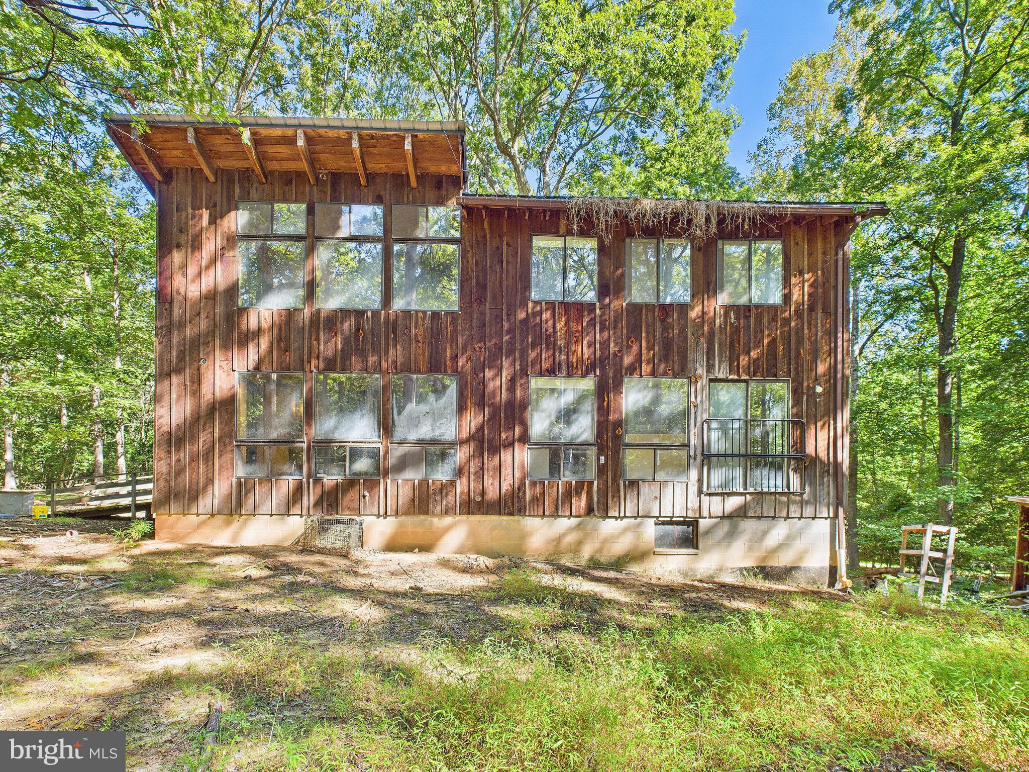 11330 Holly Springs Road Nanjemoy, MD 20662 - Photo 3 of 42 a backyard of a house with table and chairs