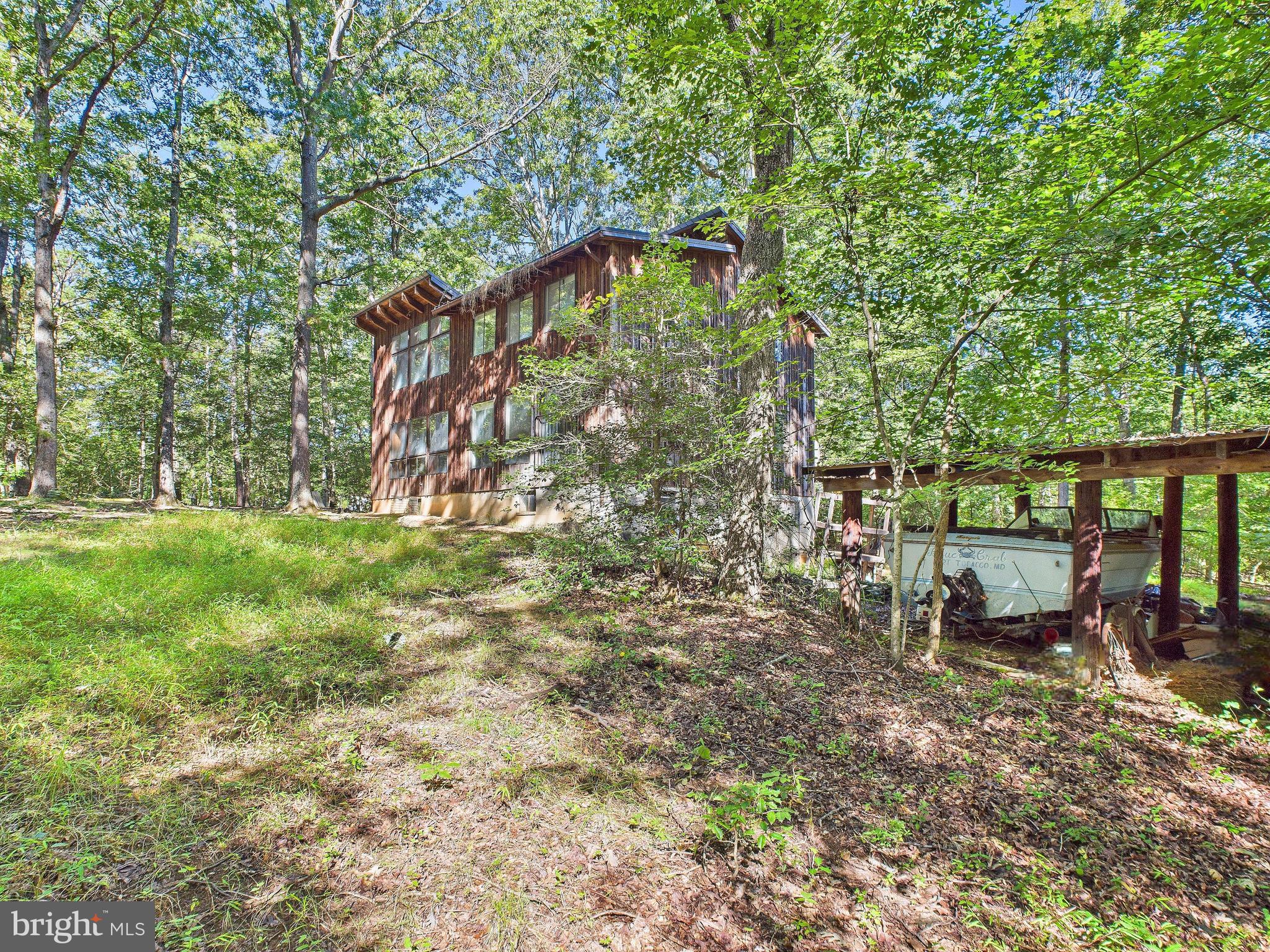 11330 Holly Springs Road Nanjemoy, MD 20662 - Photo 34 of 42 a backyard of a house with table and chairs