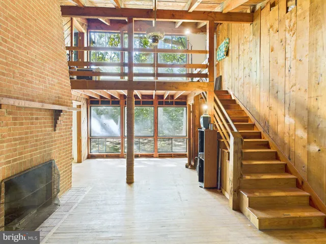 a view of an entryway with a floor to ceiling window