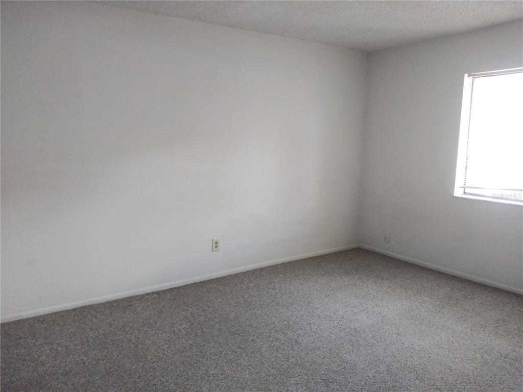 127 Springwood Circle, Unit H Longwood, FL 32750 - Photo 5 of 12 an empty room with a window