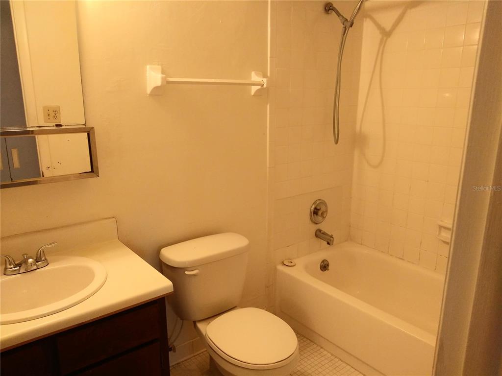 127 Springwood Circle, Unit H Longwood, FL 32750 - Photo 6 of 12 a bathroom with a sink a toilet and shower