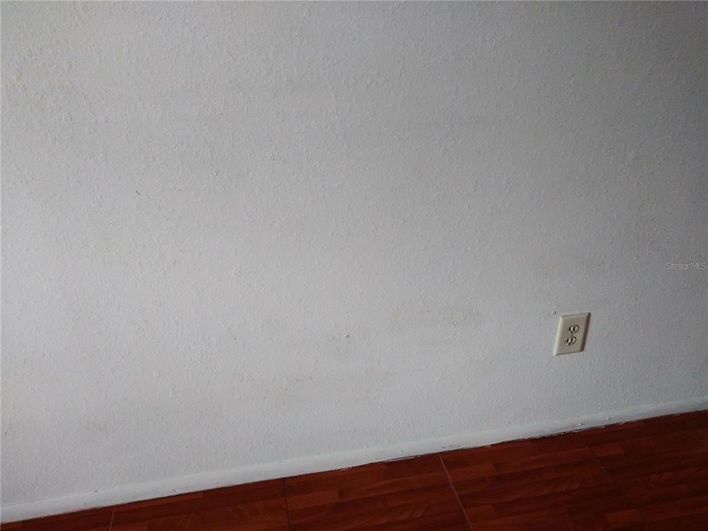 127 Springwood Circle, Unit H Longwood, FL 32750 - Photo 8 of 12 a view of an empty room with wooden floor