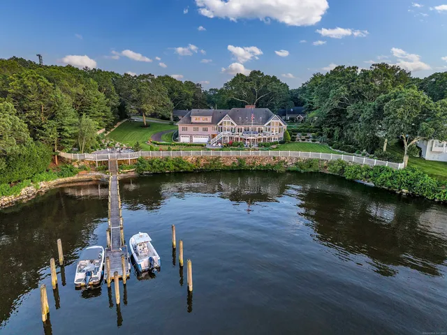aerial view of a house with a lake view