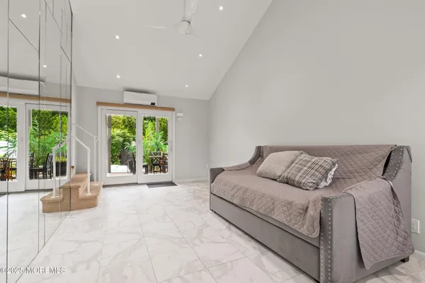 a lobby with furniture and floor to ceiling window